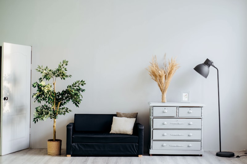 Bright elegant interior with white furniture, minimalist luxury, sunlit room, pristine decor, no people